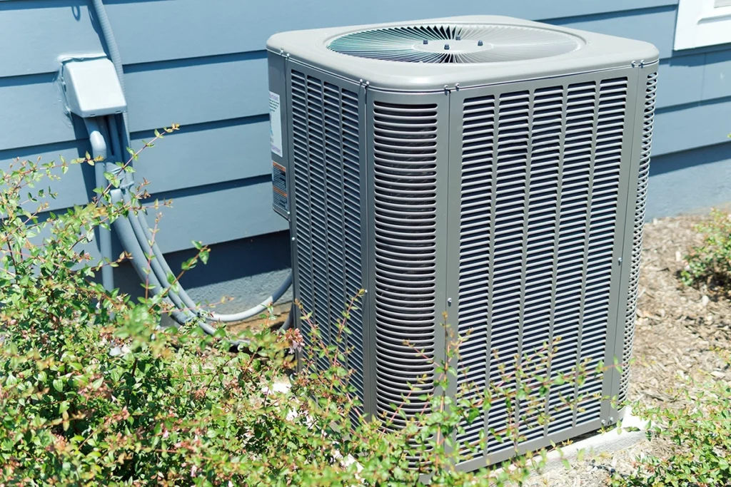 Outdoor AC unit connected to a home for air conditioner evaporator coil cooling system maintenance